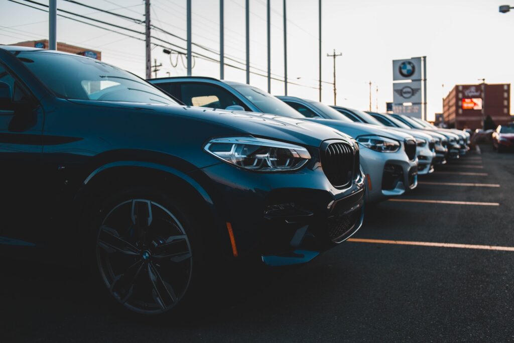 a row of cars parked in a parking lot